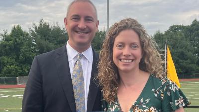 Pictured: AB Superintendent Peter Light presents the 2024 William L. Ryan Community Service Award to ABUW Executive Director Katie Neville